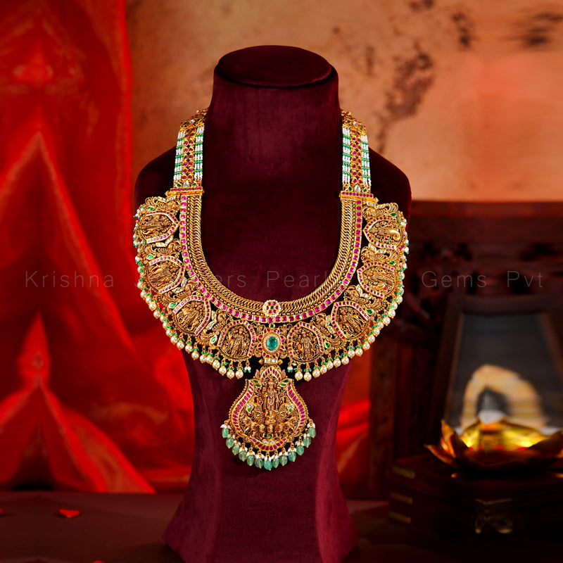 Antique Gold Temple Haram with Lakshmi Pendant, Ruby and Emerald