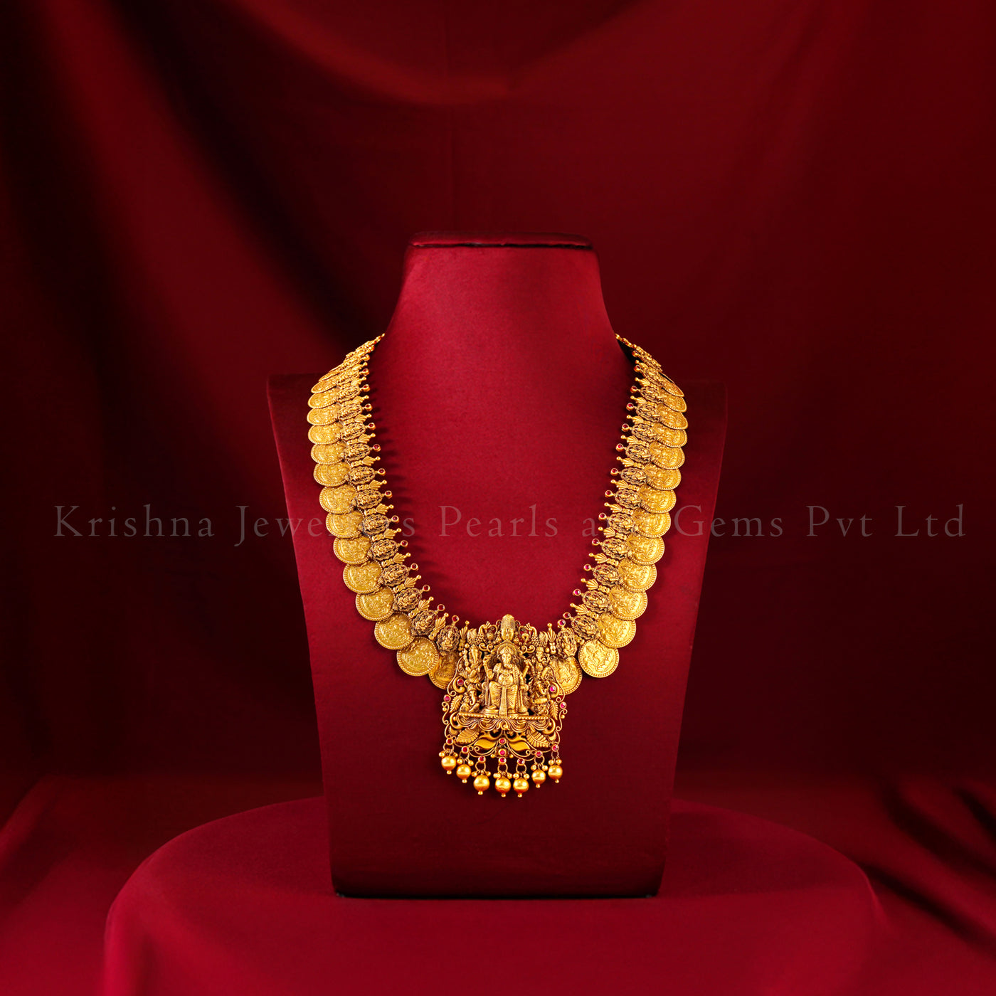 Antique gold kasu Lakshmi haram set with emerald bead drops, matching jhumkas and temple bangles by Krishna Jewellers