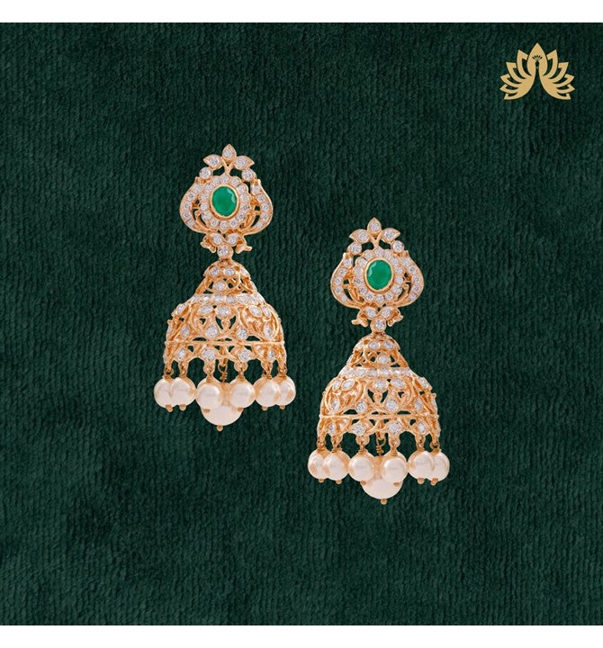 Floral patterns the pretty Earrings crafted using Oval cut Emeralds