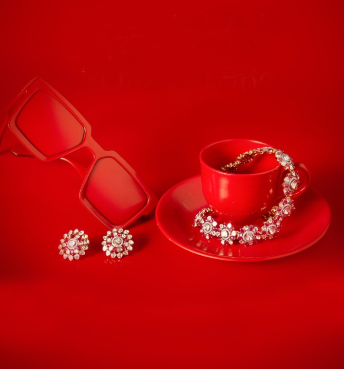 Red Bride playfully paired of Polki in a Necklace and Ear Stud set