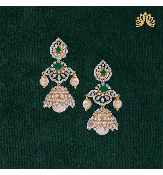 Floral Patterns, Pretty Earrings Crafted using yellow gold with the Emeralds