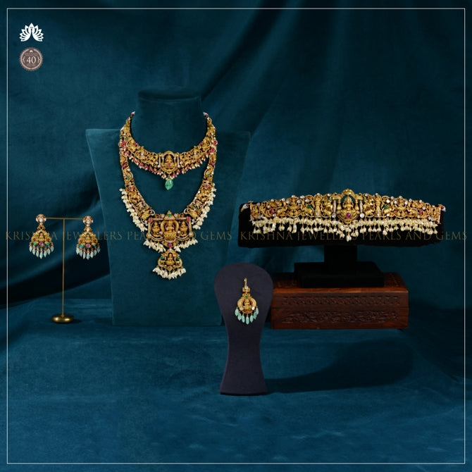 Grand Lakshmi Motif Gold Polki Bridal Jewellery Set with Emerald and Pearl Accents