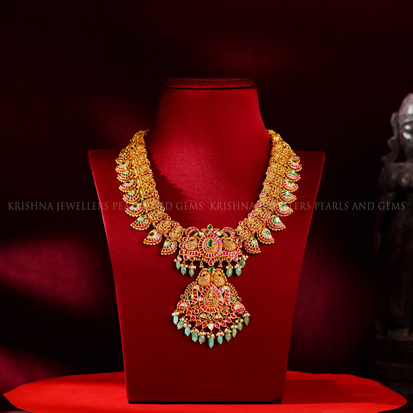 22K nakshi kundan mango haram with ruby and emerald kemp stones, Lakshmi pendant and emerald bead drops by Krishna Jewellers
