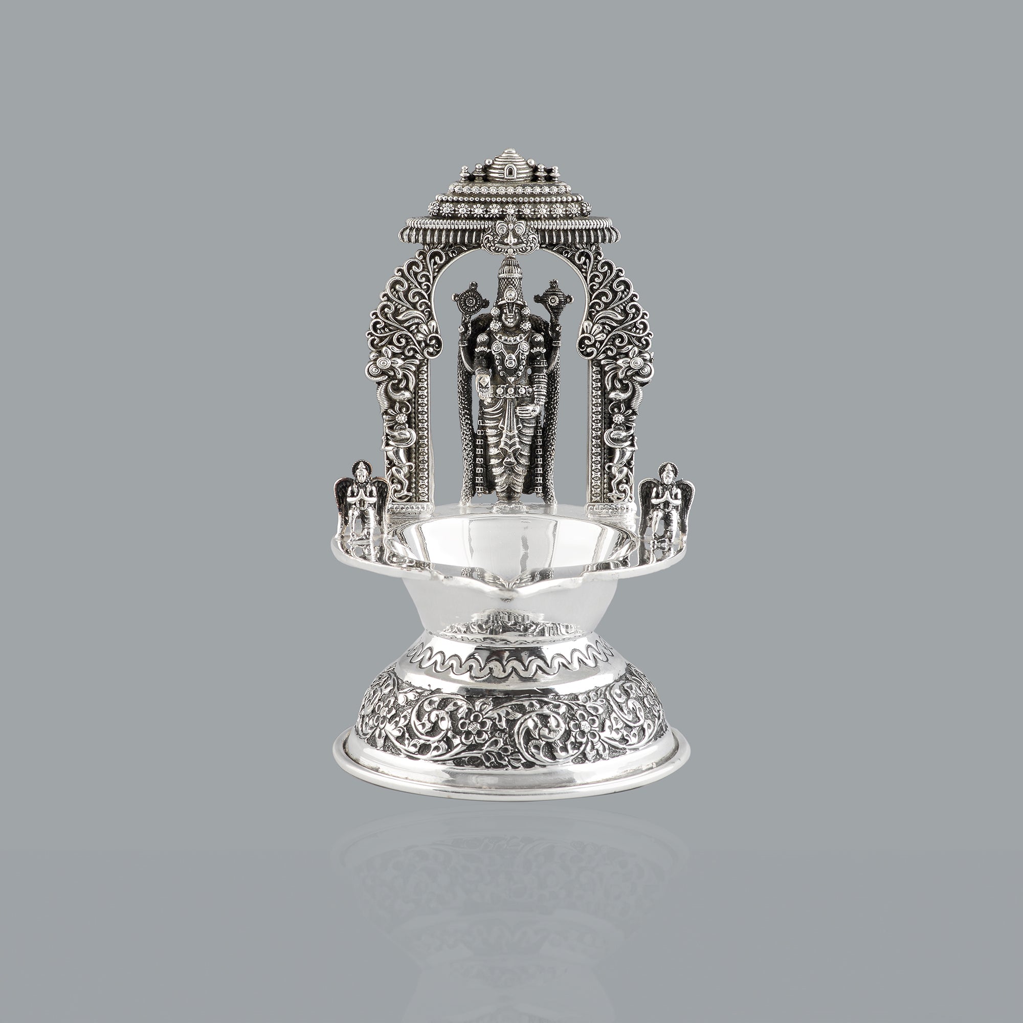 Divine glow from silver lord venkateshwara diya