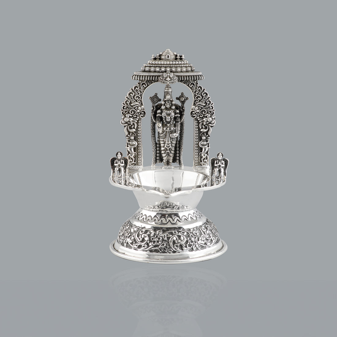 Divine glow from silver lord venkateshwara diya