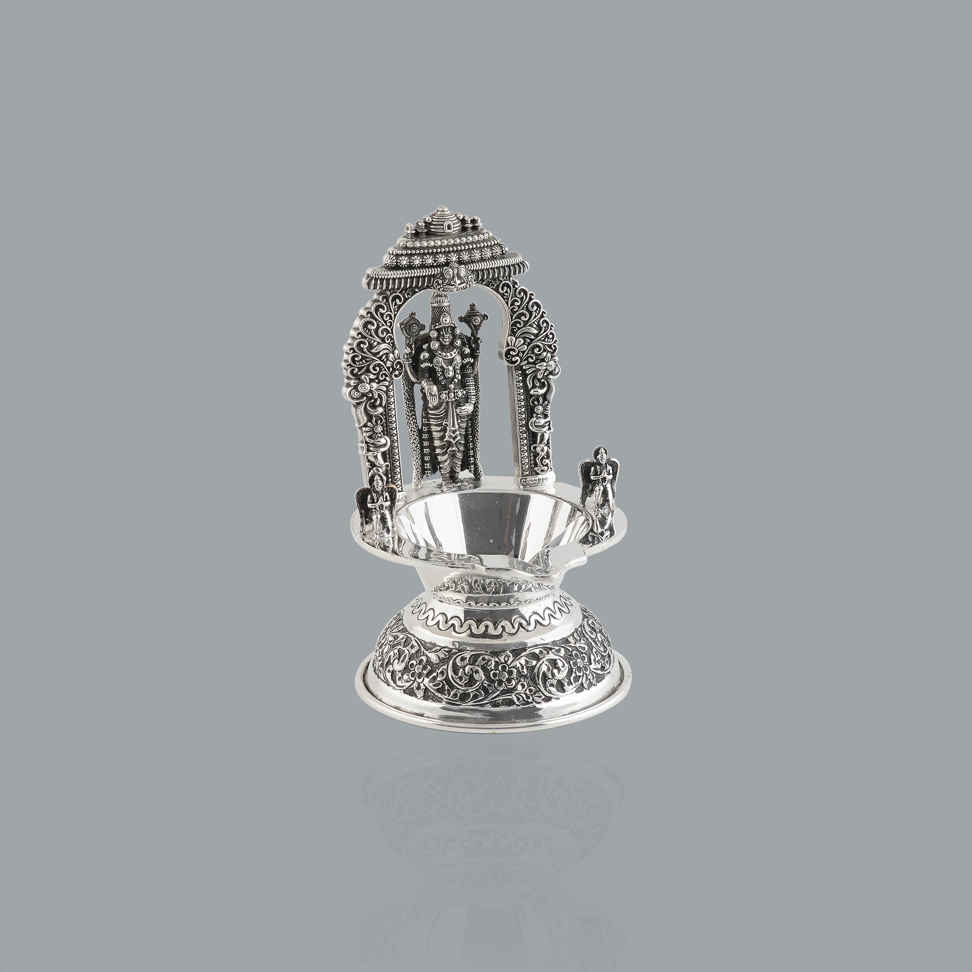 Divine glow from silver lord venkateshwara diya