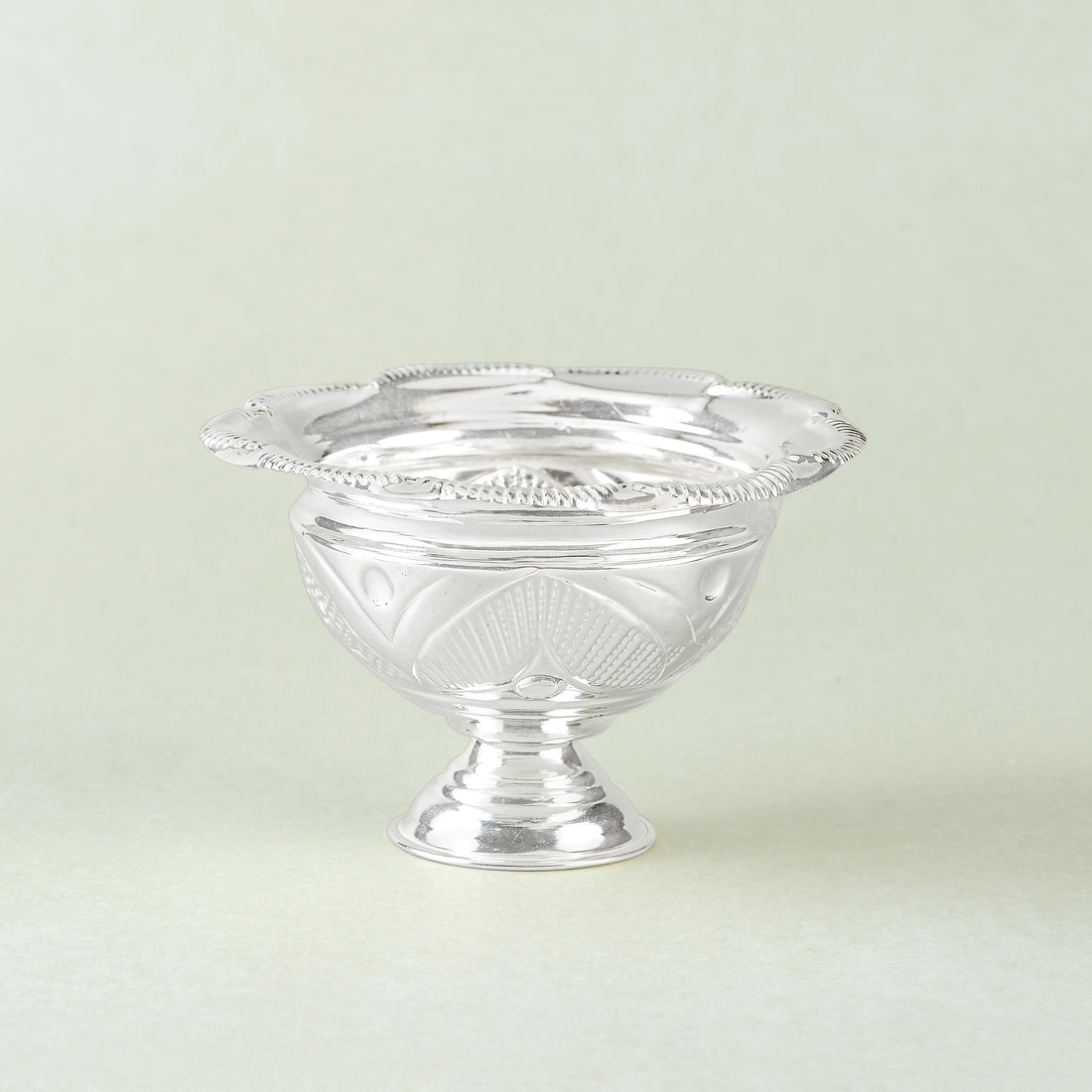 Silver bowls with flower petal motifs.