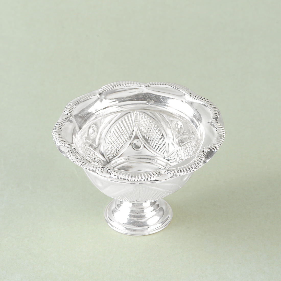 Silver bowls with flower petal motifs.