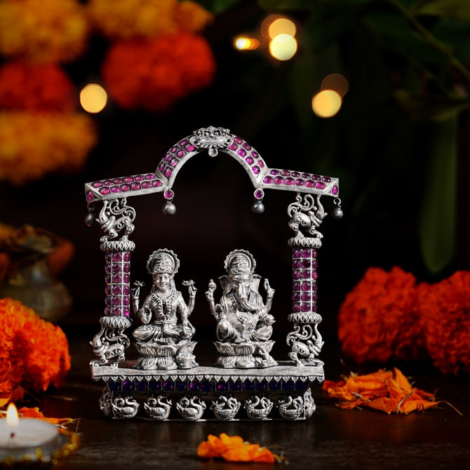 Lakshmi Devi and Ganesh Idol with Peacock and Elephant Arch