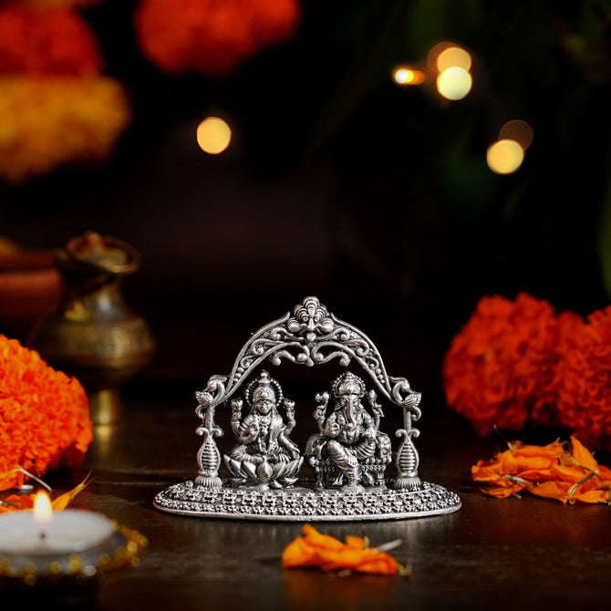 Lakshmi Devi and Ganesh Idol with Peacock Arch