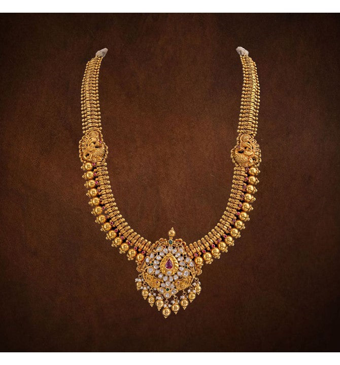 Gold necklace with Polki diamond and ruby centered pendant