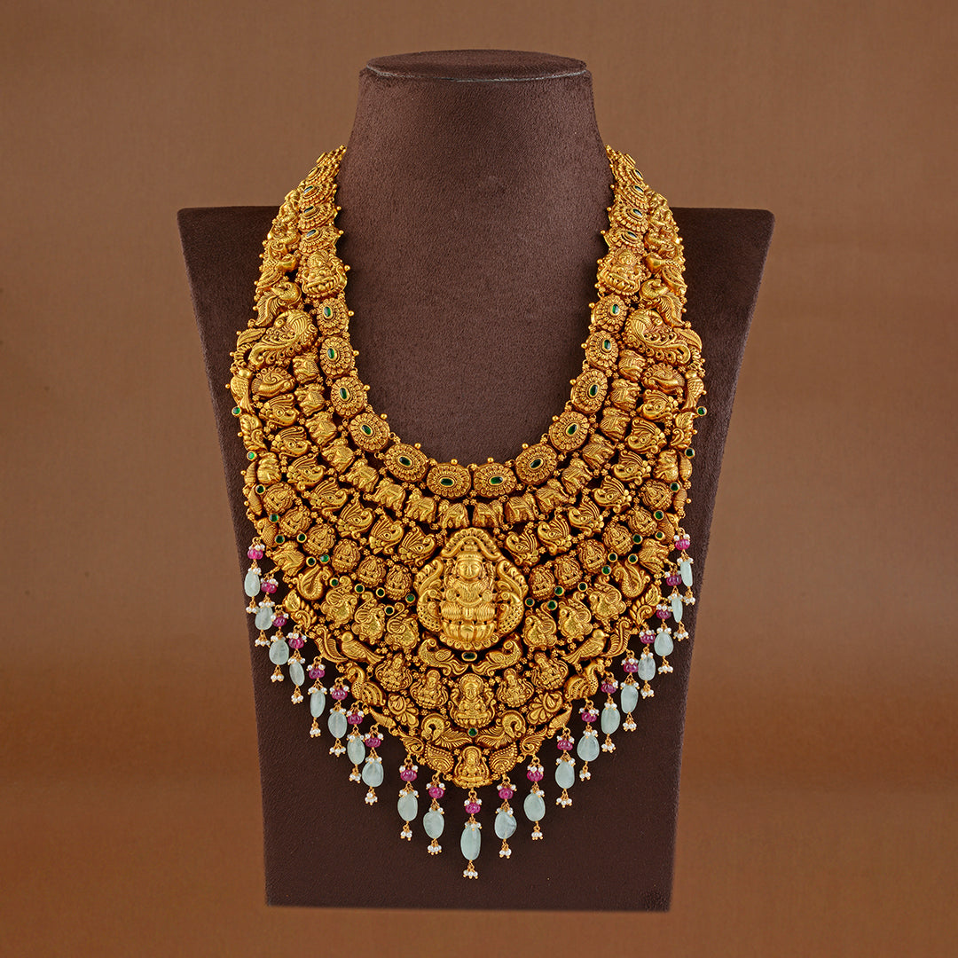 Goddess Lakshmi Long Gold Haram in Nakshi Work - Krishna Jewellers Pearls and Gems