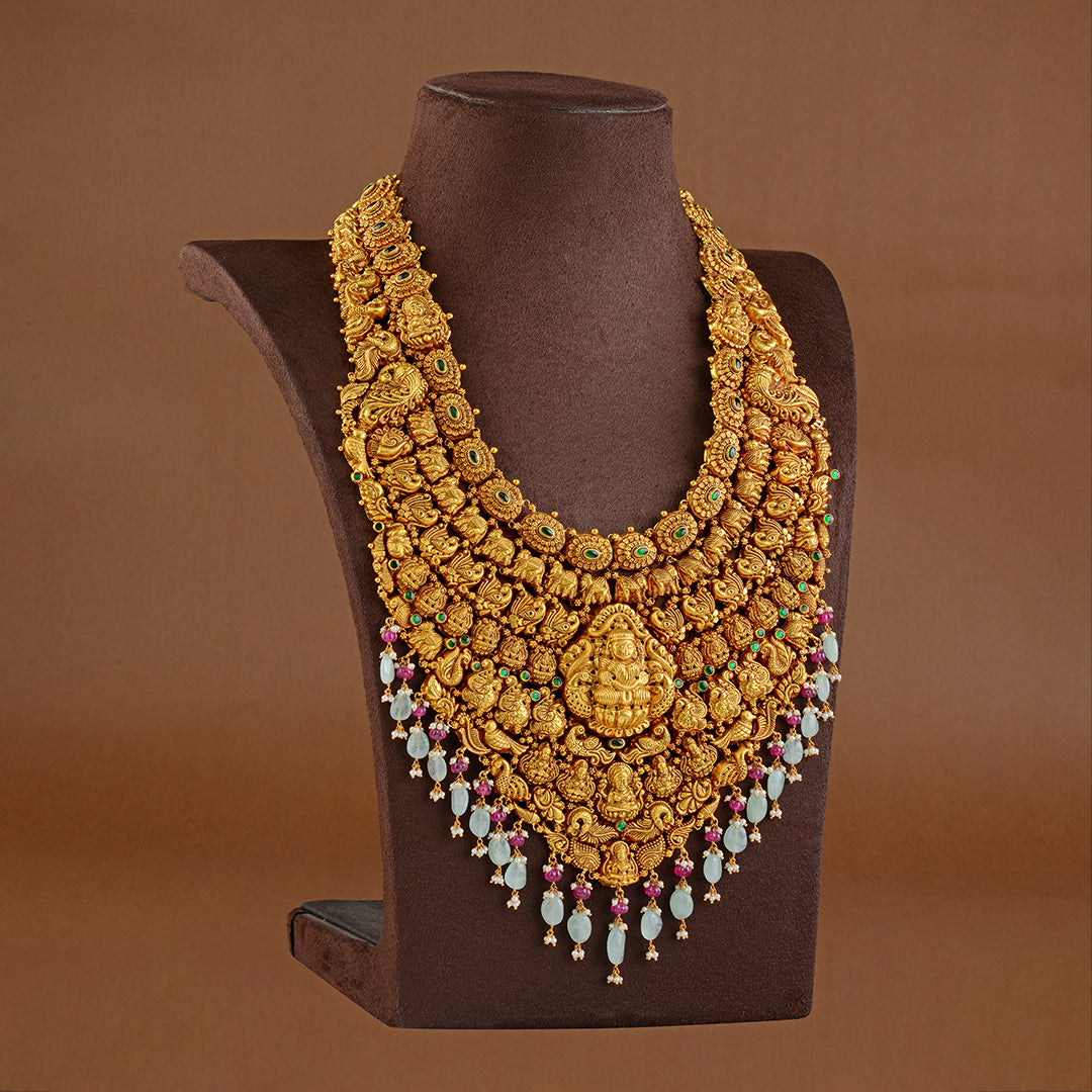 Goddess Lakshmi Long Gold Haram in Nakshi Work - Krishna Jewellers Pearls and Gems