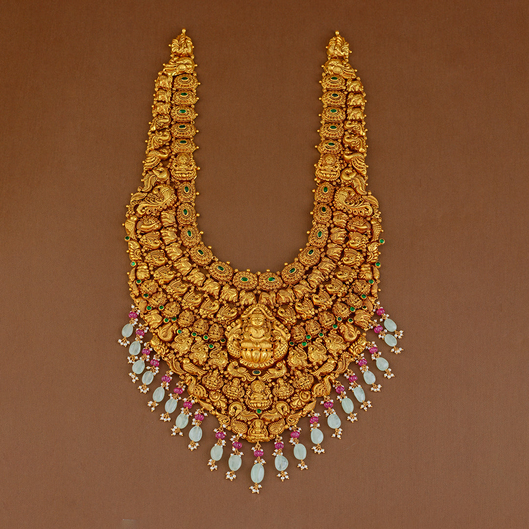 Goddess Lakshmi Long Gold Haram in Nakshi Work - Krishna Jewellers Pearls and Gems