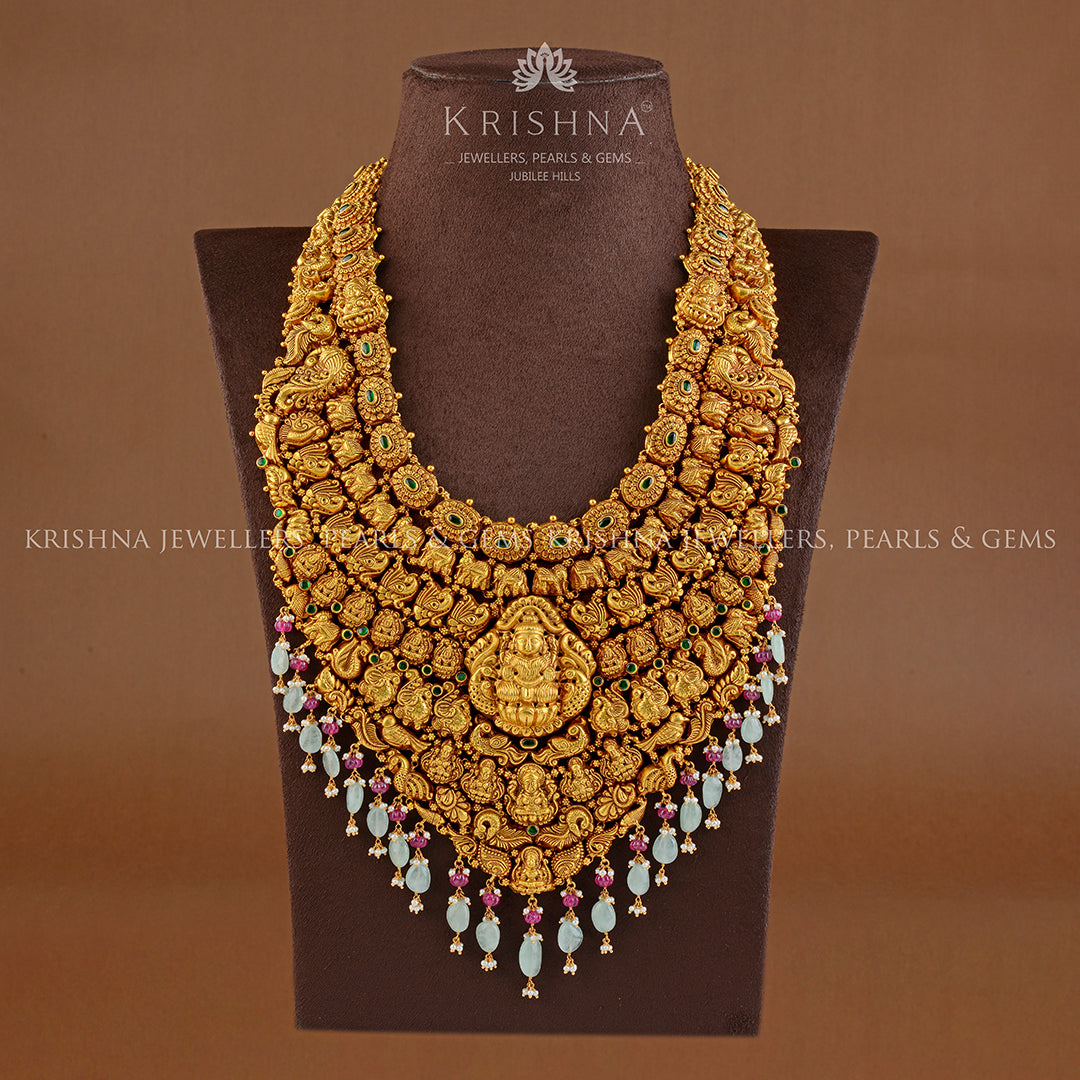 Goddess Lakshmi Long Gold Haram in Nakshi Work - Krishna Jewellers Pearls and Gems