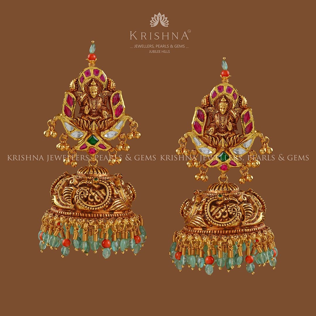 Gold Jhumka  Earrings in Lakshmi Motif - Krishna Jewellers Pearls and Gems